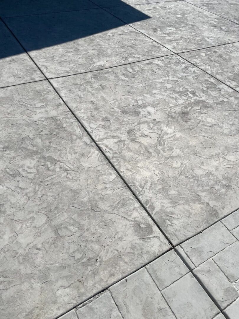 Stamped concrete floor with textured pattern.