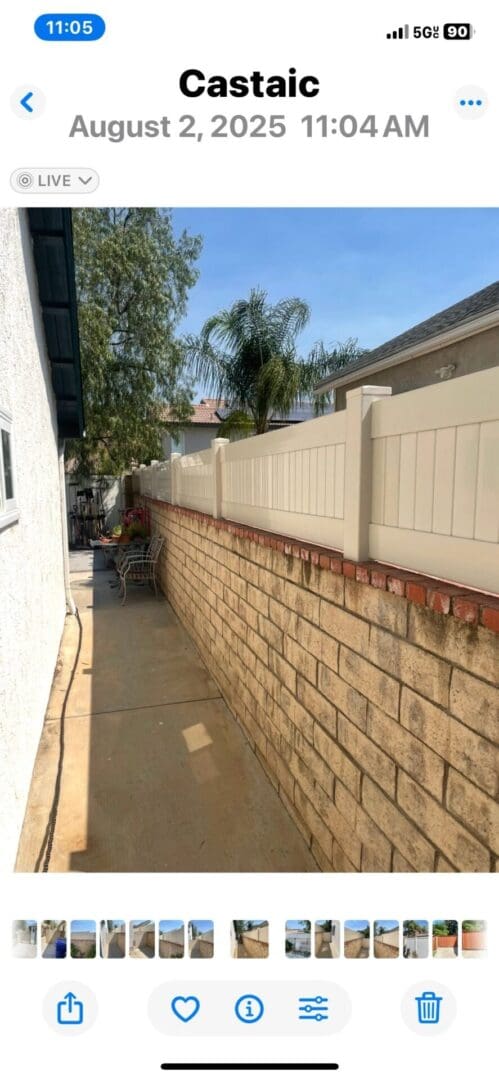 Narrow walkway beside a brick wall.