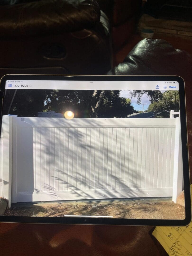 White fence displayed on a tablet screen.